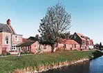 a view of the riverbank studios from across the river